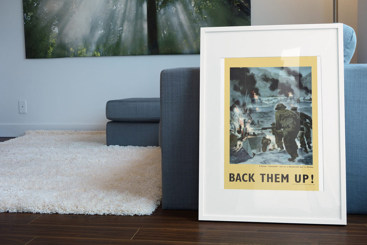 Back Them Up — Soldiers Ashore poster leaning beside a blue sofa