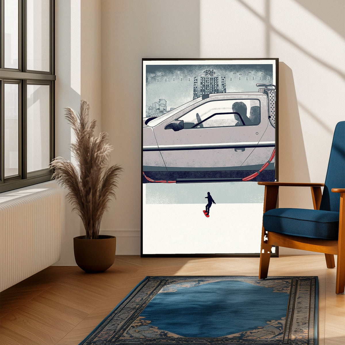 Back to the Future Part II (1989) Movie DeLorean Hover Art poster framed beside a blue armchair in a sunlit room