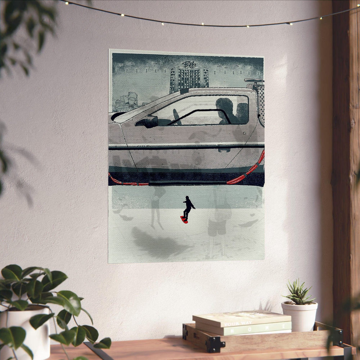 Back to the Future Part II (1989) Movie DeLorean Hover Art poster unframed on a white wall above a desk
