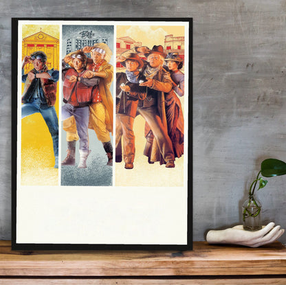 Back to the Future Trilogy Movie Triptych Art poster in a black frame on a wooden shelf against concrete