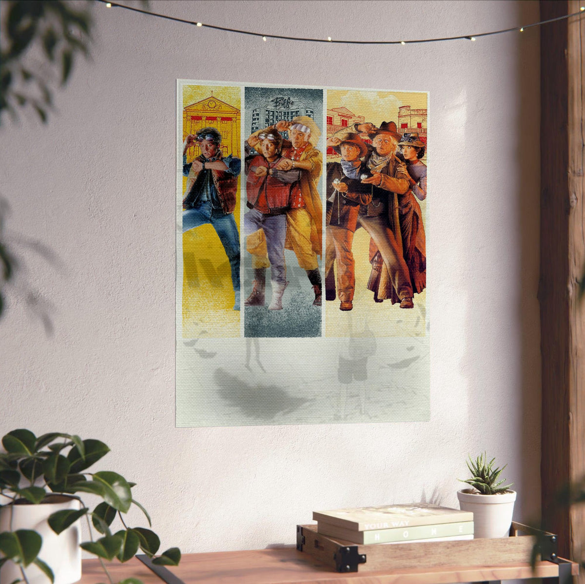 Back to the Future Trilogy Movie Triptych Art poster unframed on a white wall above a desk