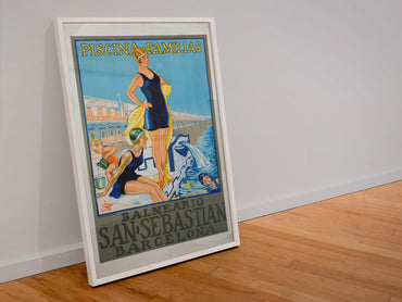 Balneario San Sebastian Barcelona poster in a white frame leaning against a wall