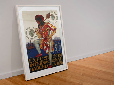 Barcelona Exposition 1929 poster in a white frame leaning against a wall