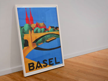 Basel Switzerland poster in a white frame leaning against a wall