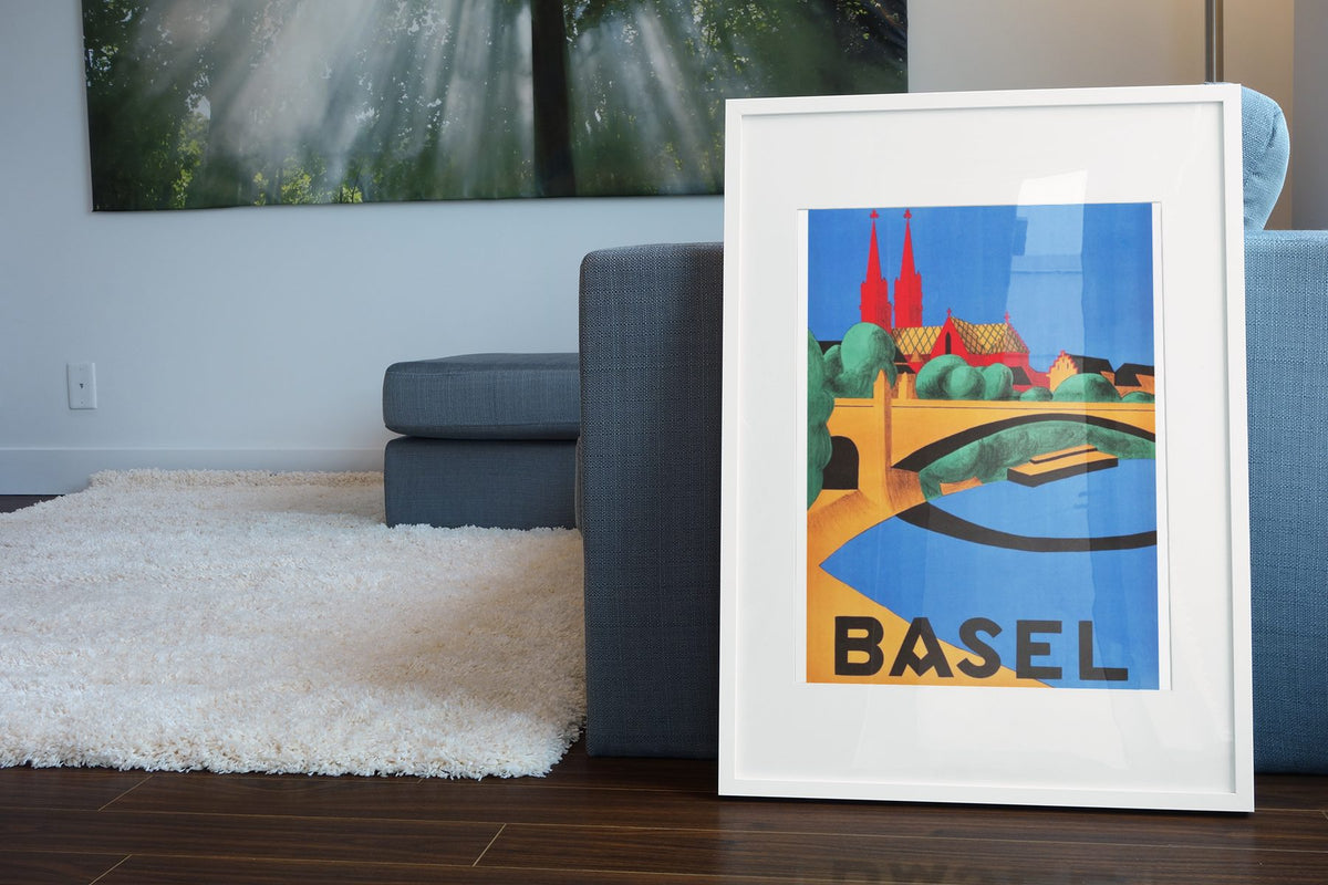 Basel Switzerland poster leaning beside a blue sofa