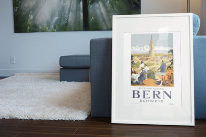 Bern View from the Kursaal poster leaning beside a blue sofa