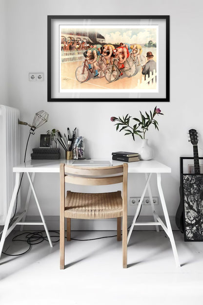 Bicycle Race poster framed above a desk in a bright white room