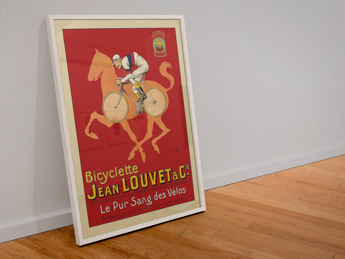 Jean Louvet Pur Sang des Velos poster in a white frame leaning against a wall
