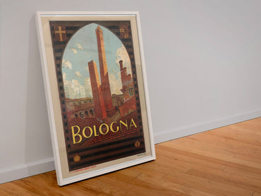 Bologna poster in a white frame leaning against a wall