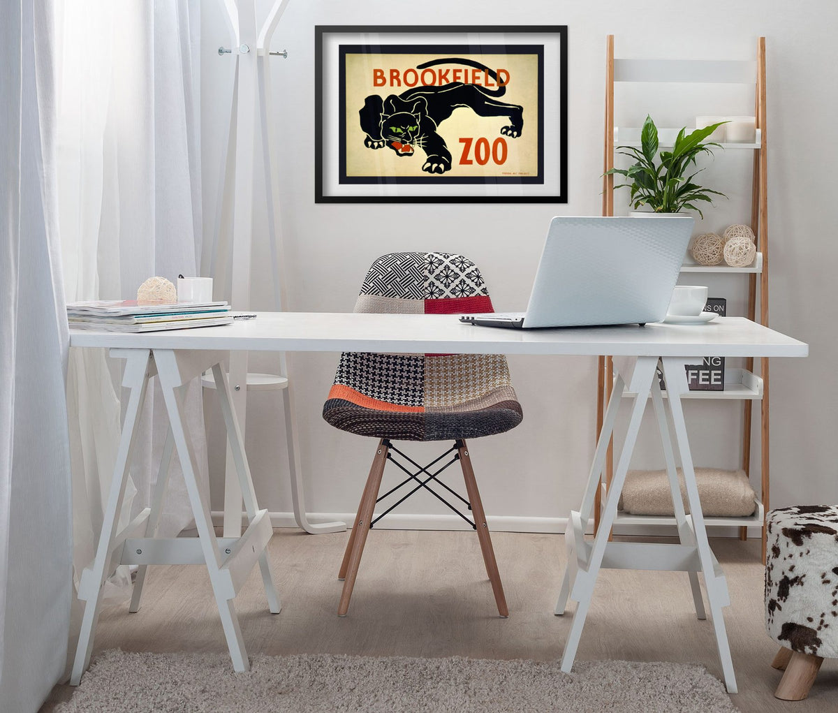 Brookfield Zoo Black Panther poster framed above a white desk in a home office