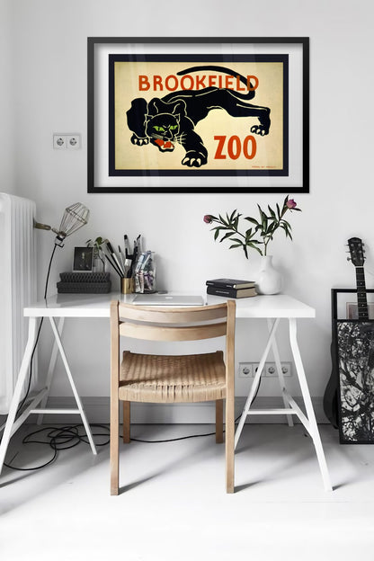 Brookfield Zoo Black Panther poster framed above a desk in a bright white room