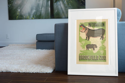 Brookfield Zoo Hippo poster leaning beside a blue sofa