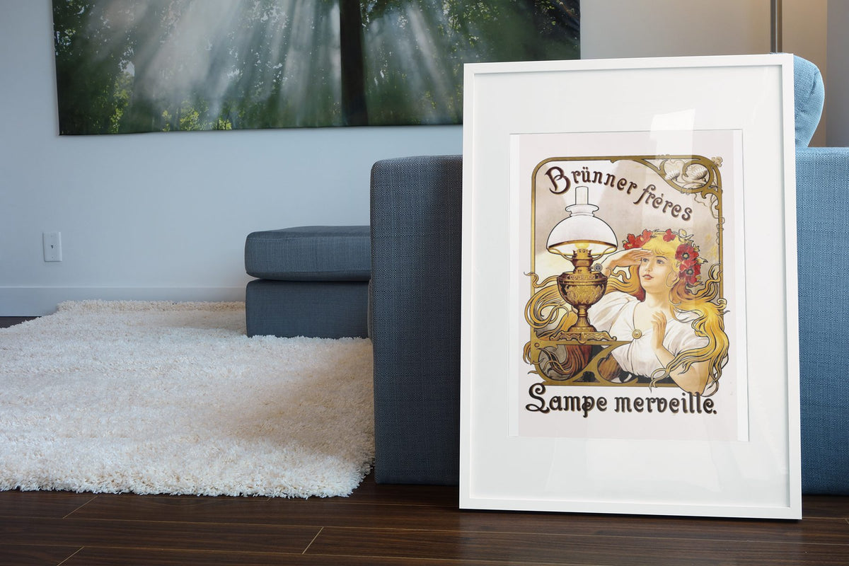 Brunner Freres Lamps poster leaning beside a blue sofa
