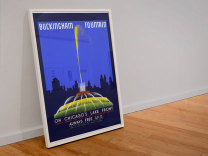 Buckingham Fountain Chicago poster in a white frame leaning against a wall