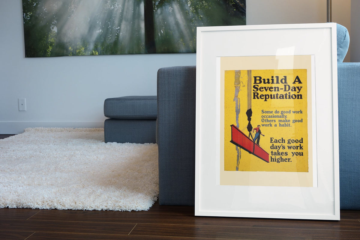 Build a Seven-Day Reputation poster in a white frame leaning beside a blue sofa
