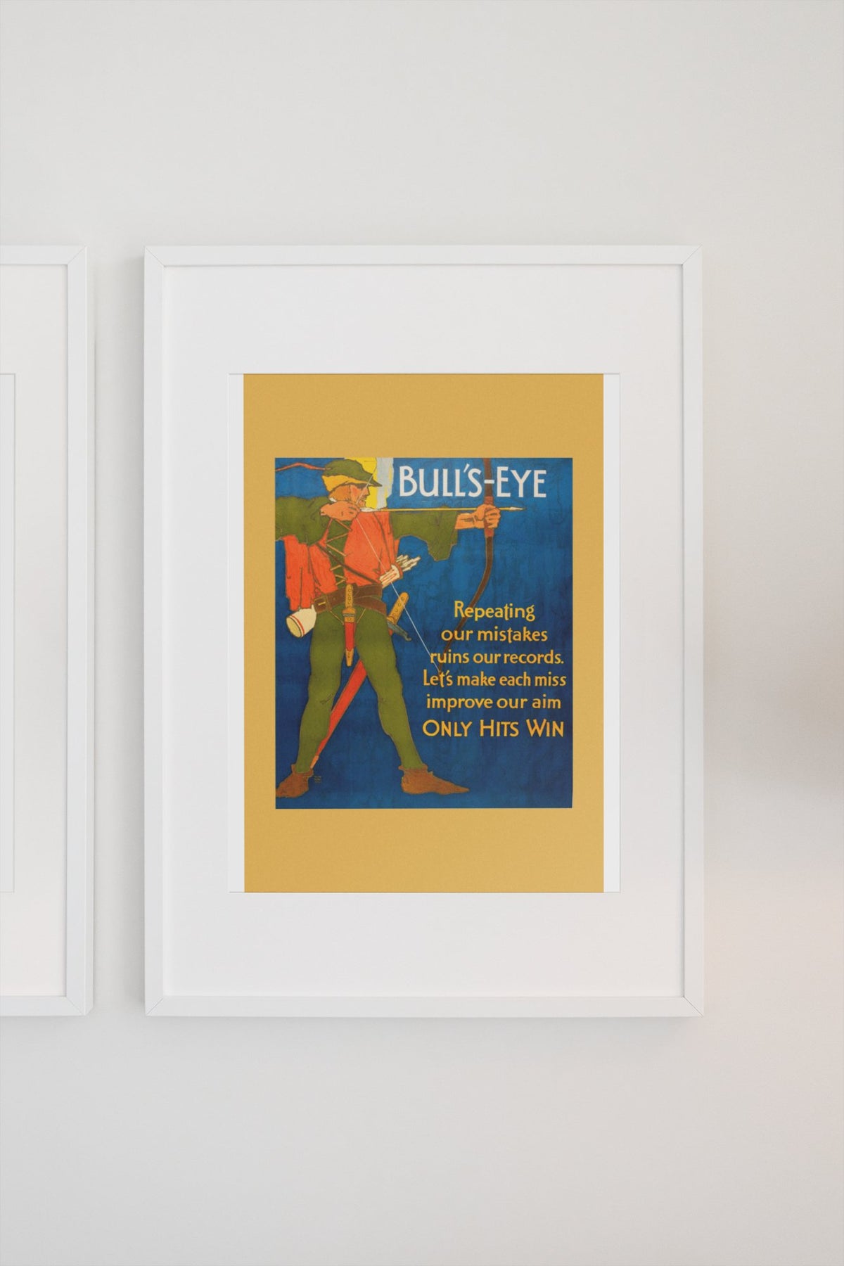 Bull’s-Eye poster in a white frame on a light wall