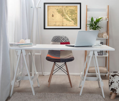 California as an Island Map print framed above a white desk in a home office