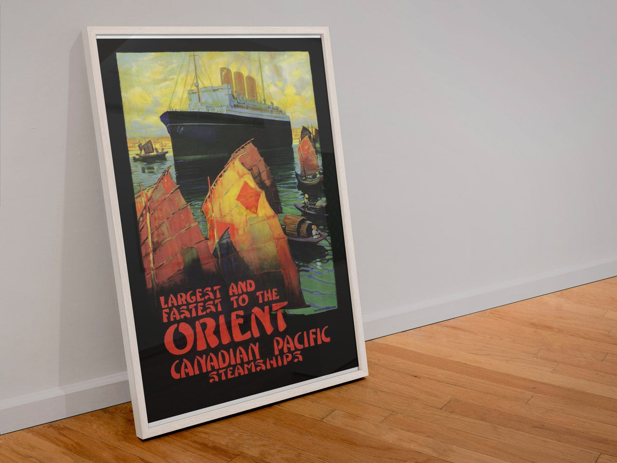 Canadian Pacific to the Orient poster in a white frame leaning against a wall