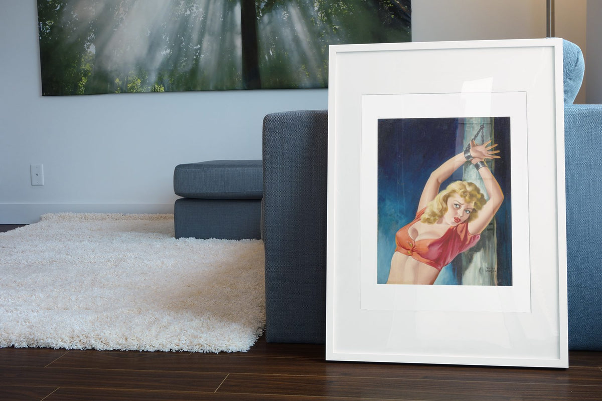 Captive Audience poster leaning beside a blue sofa