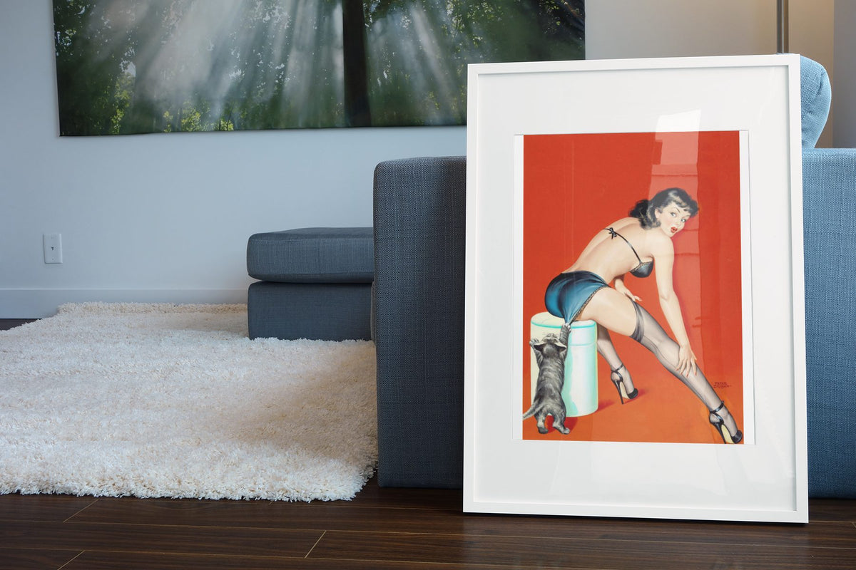 Cat Scratch Fever poster leaning beside a blue sofa