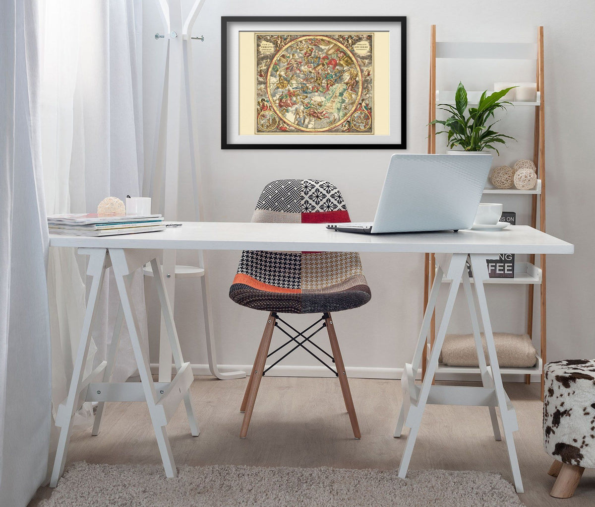 Cellarius Christian Star Chart 1660 print framed above a white desk in a home office