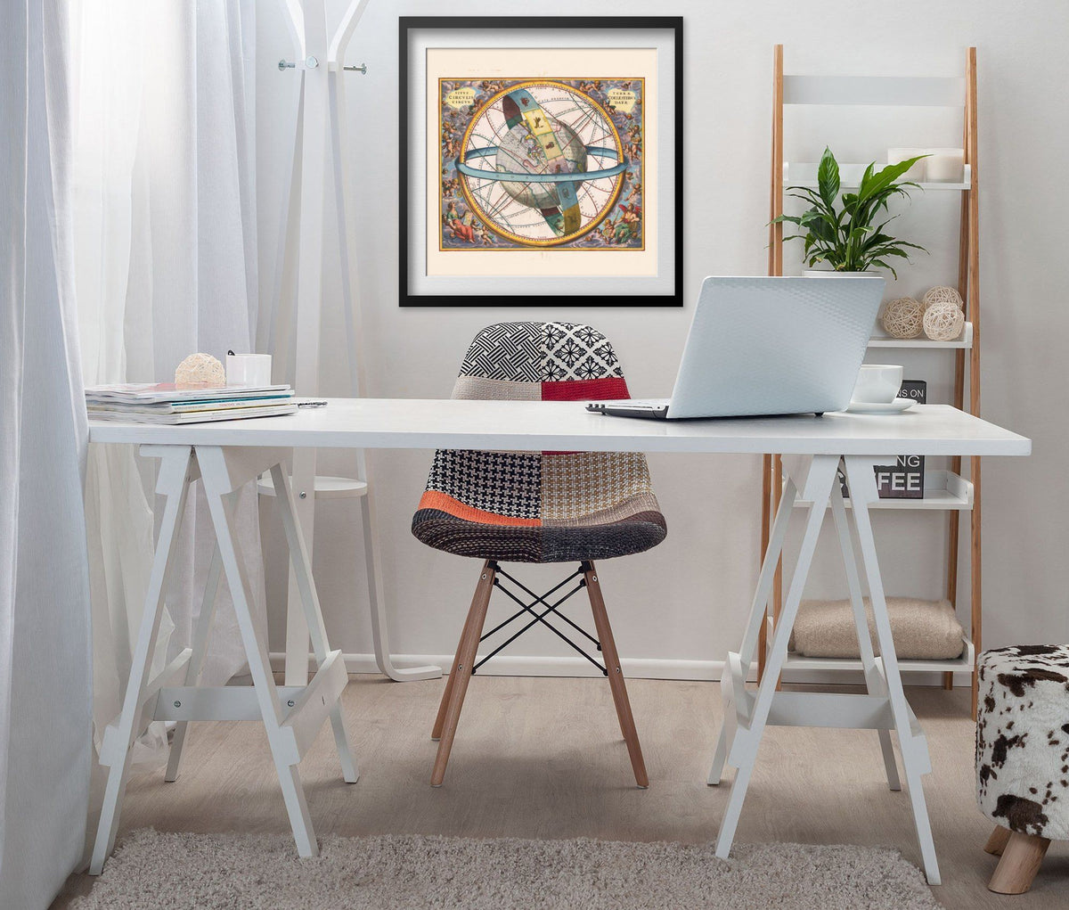 Cellarius Earth & Celestial Circles 1660 print framed above a white desk in a home office