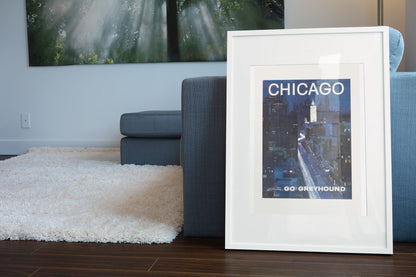 Chicago Greyhound poster leaning beside a blue sofa
