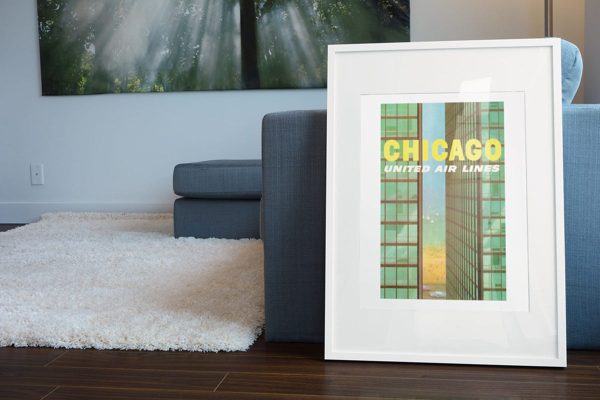 Chicago United Air Lines 1961 poster leaning beside a blue sofa