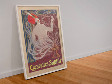 Cigarettes Saphir poster in a white frame leaning against a wall