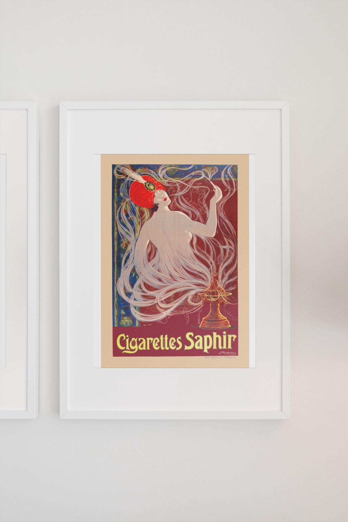 Cigarettes Saphir poster on a light wall