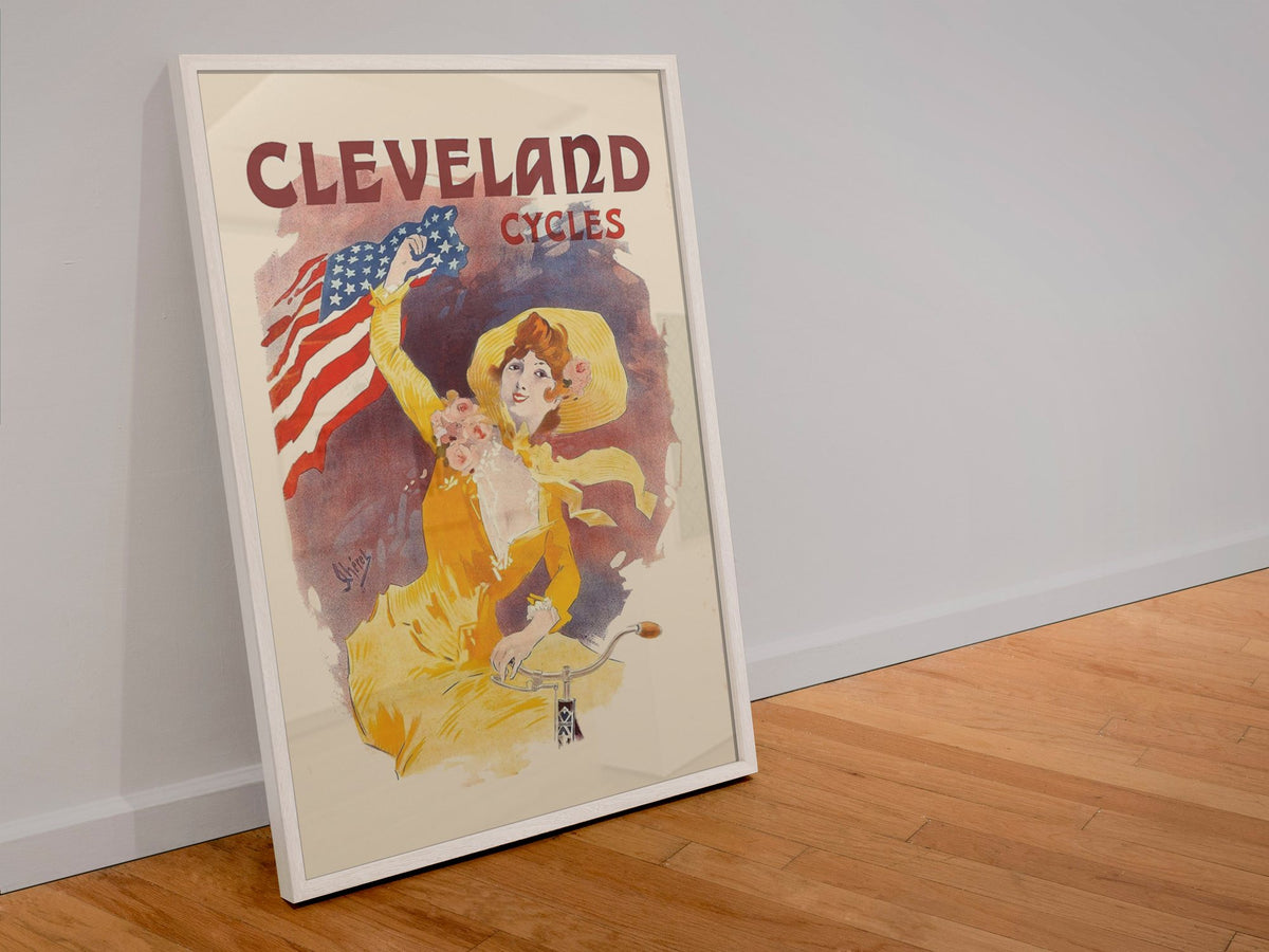 Cleveland Cycles Cheret poster in a white frame leaning against a wall