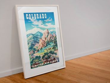 Colorado United Air Lines poster in a white frame leaning against a wall