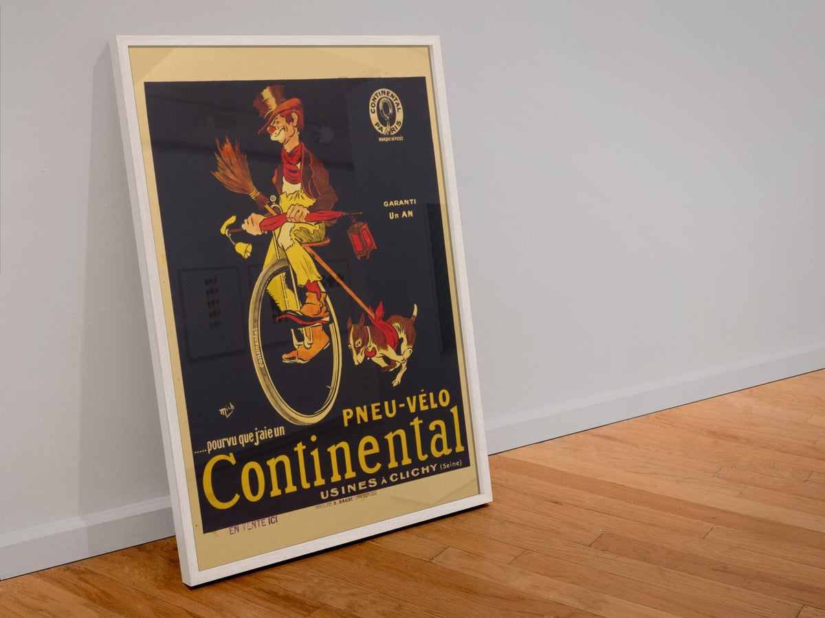 Continental Pneu Velo Tramp poster in a white frame leaning against a wall