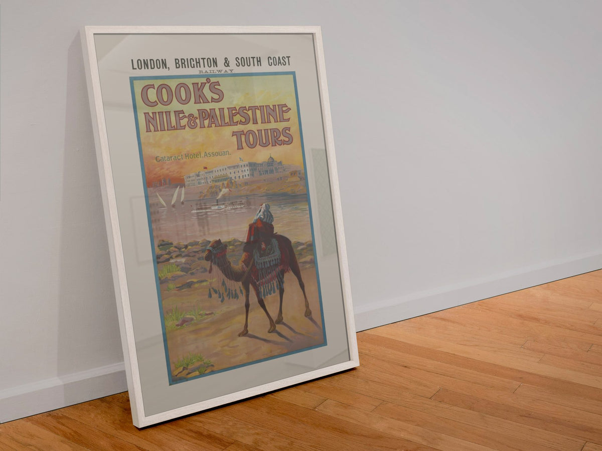 Cooks Nile and Palestine Tours poster in a white frame leaning against a wall