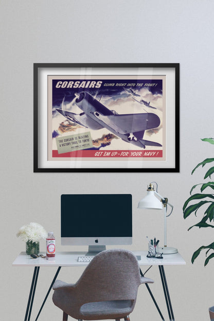 Corsairs Climb Right into the Fight poster framed on a grey wall above a desk