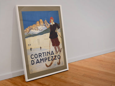 Cortina d Ampezzo poster in a white frame leaning against a wall