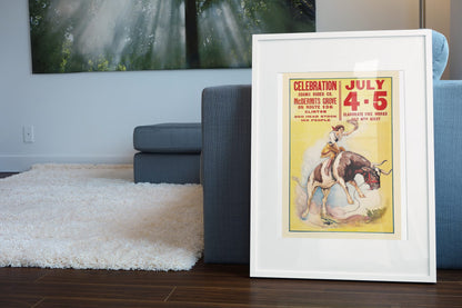 Cowgirl Rodeo Celebration July 4 5 poster leaning beside a blue sofa