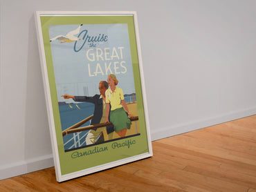 Cruise the Great Lakes Canadian Pacific poster in a white frame leaning against a wall