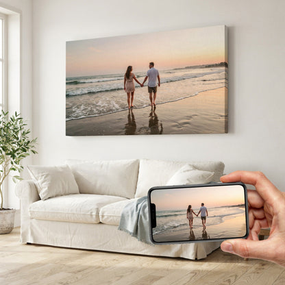 Example: a beach sunset photo on a phone, printed as a horizontal gallery-wrapped canvas above a sofa