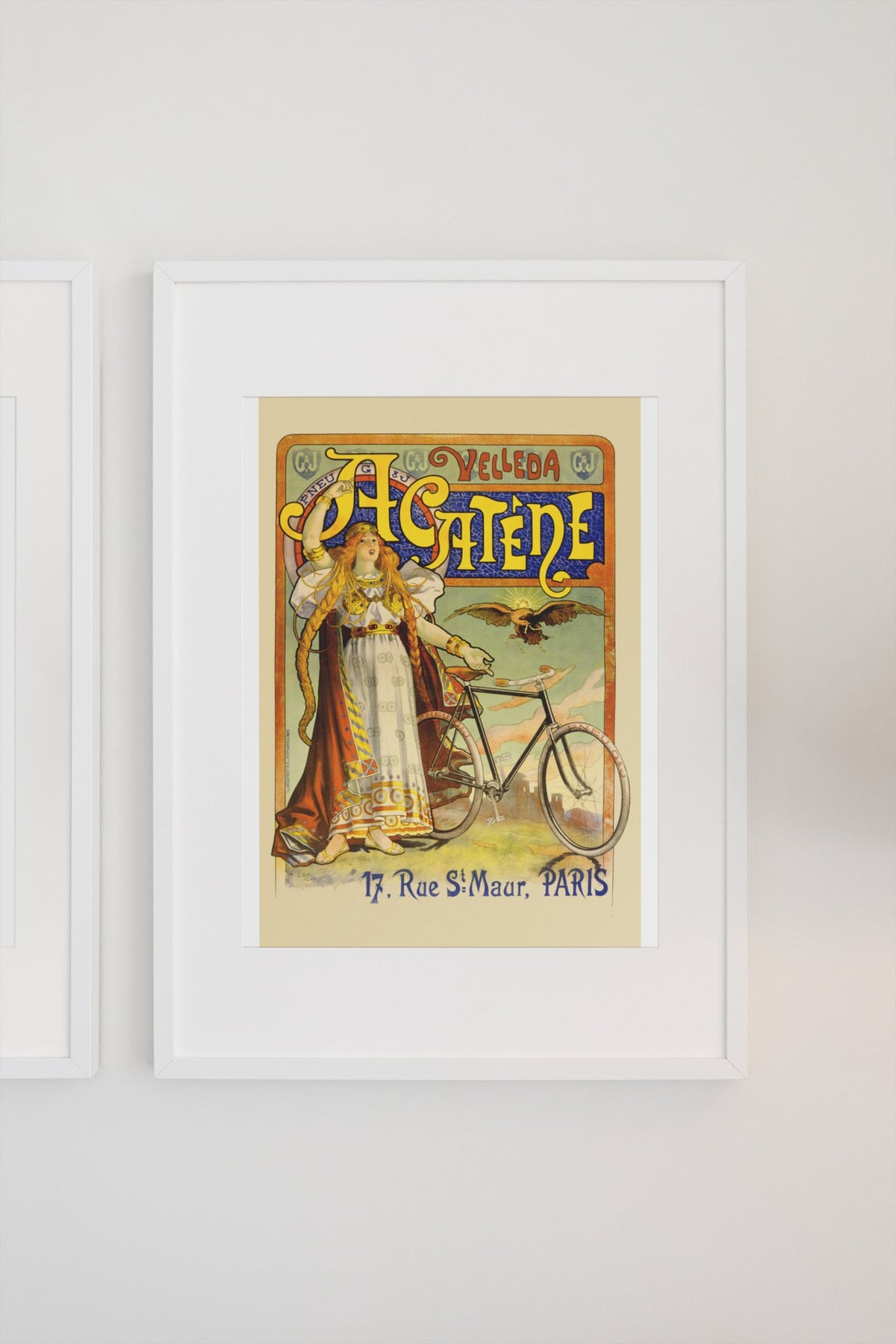 Cycles Acatène Paris bicycle poster in a white frame on a light wall