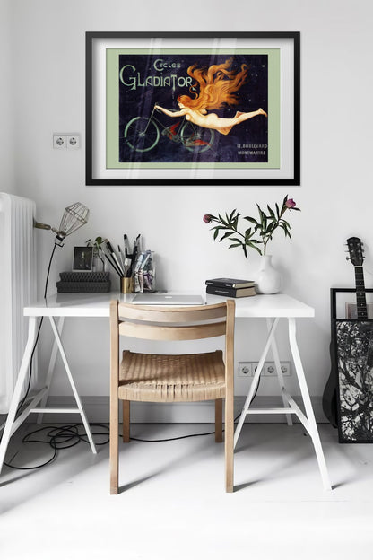 Cycles Gladiator poster framed above a desk in a bright white room