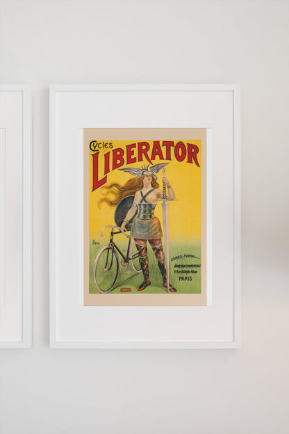 Cycles Liberator 1899 bicycle poster in a white frame on a light wall