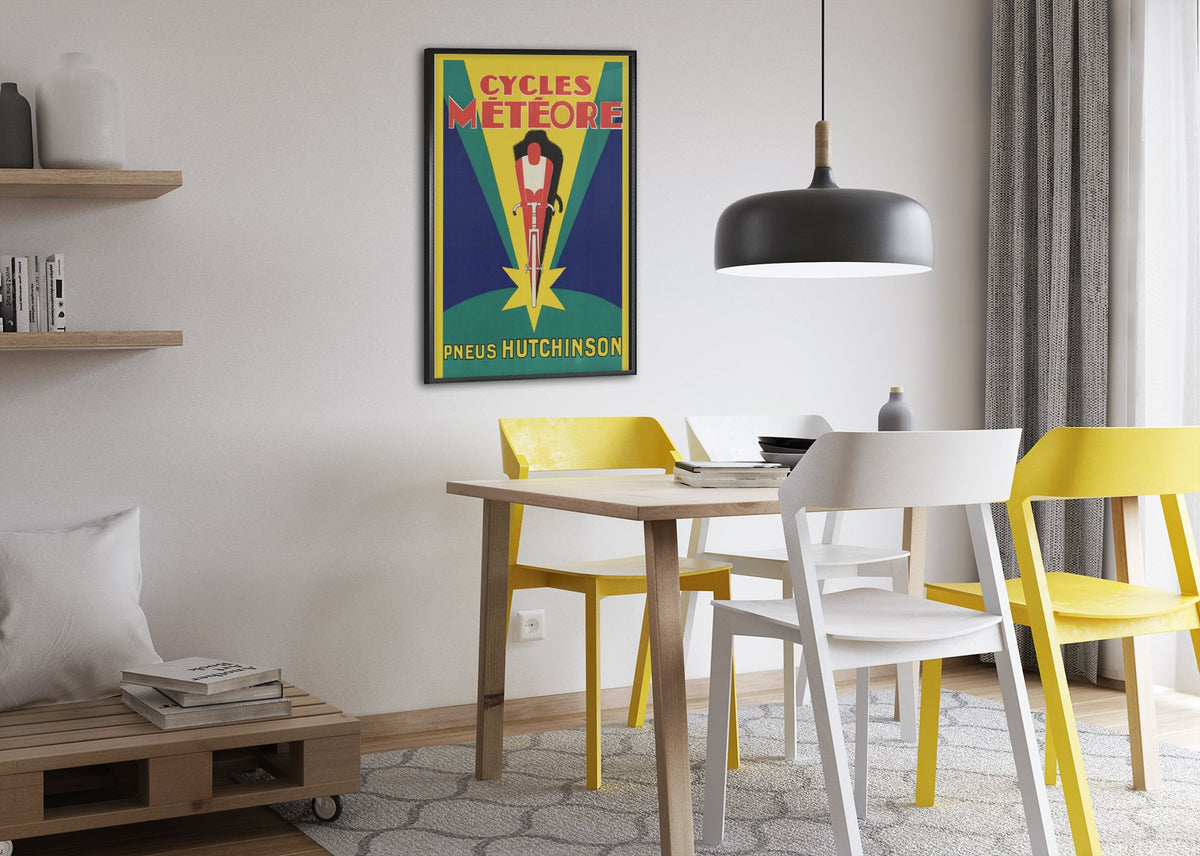 Cycles Meteore Hutchinson poster framed above a dining table