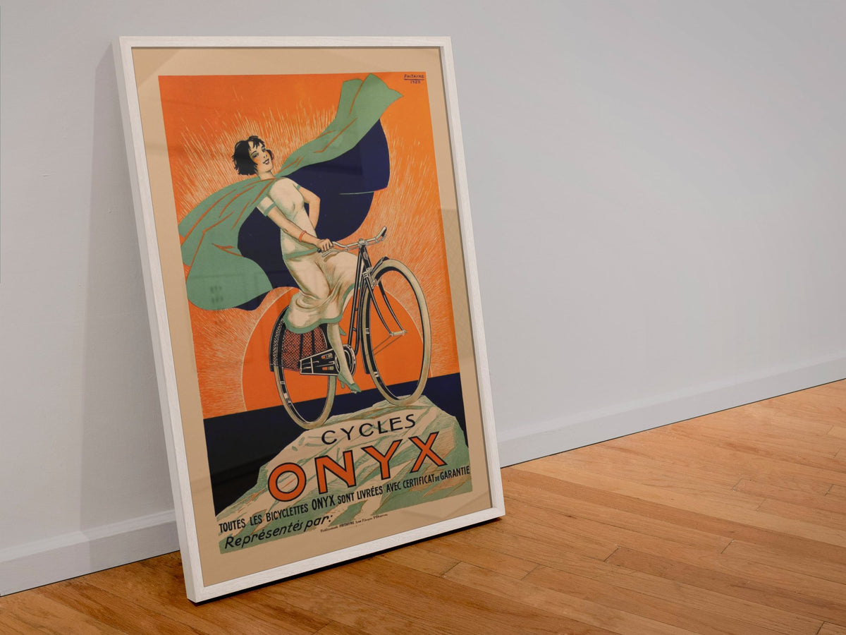 Cycles Onyx poster in a white frame leaning against a wall