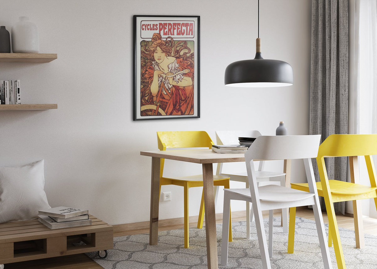 Mucha Cycles Perfecta poster framed above a dining table