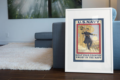 Damn the Torpedoes Enlist in the Navy poster leaning beside a blue sofa