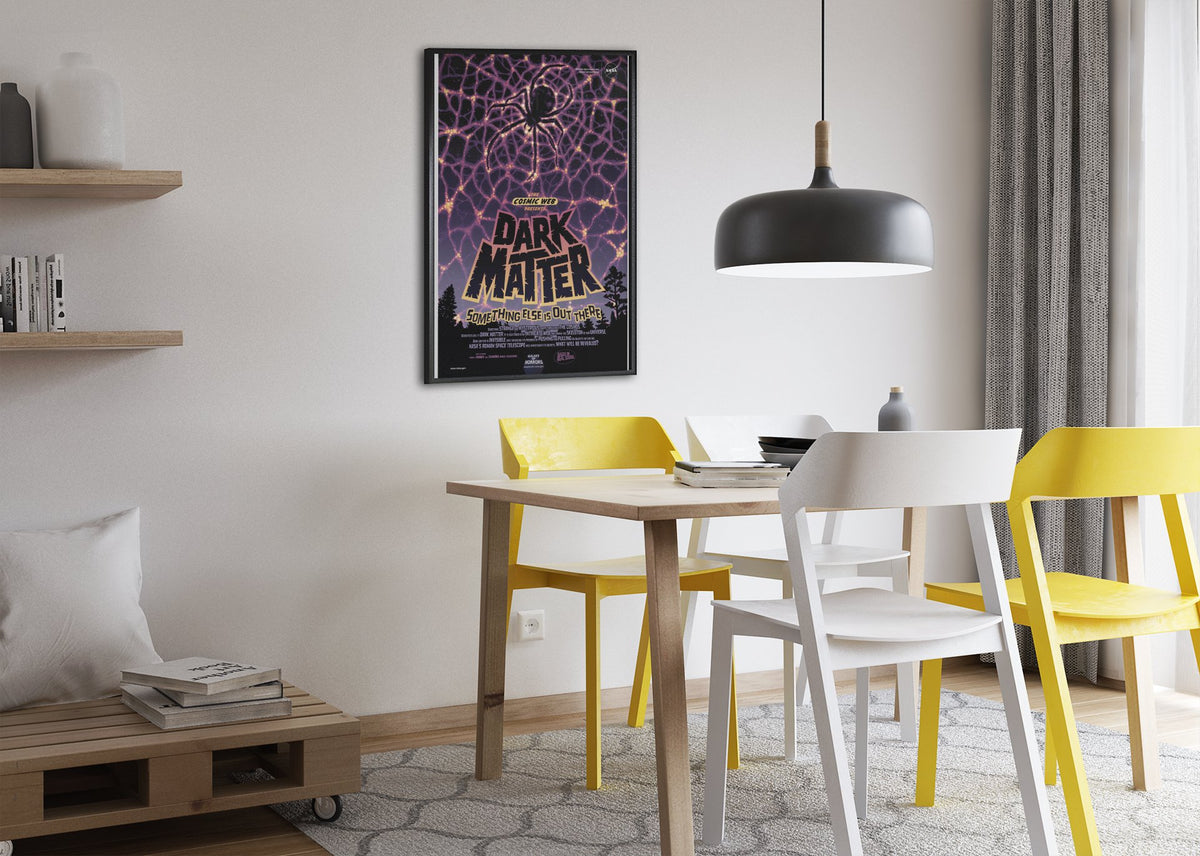 Dark Matter, NASA Galaxy of Horrors poster framed above a dining table