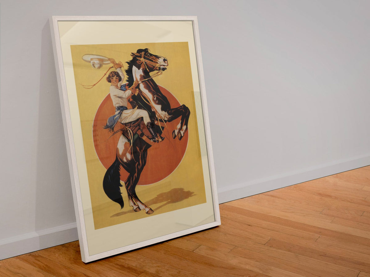 Days of the Golden West Rodeo poster in a white frame leaning against a wall