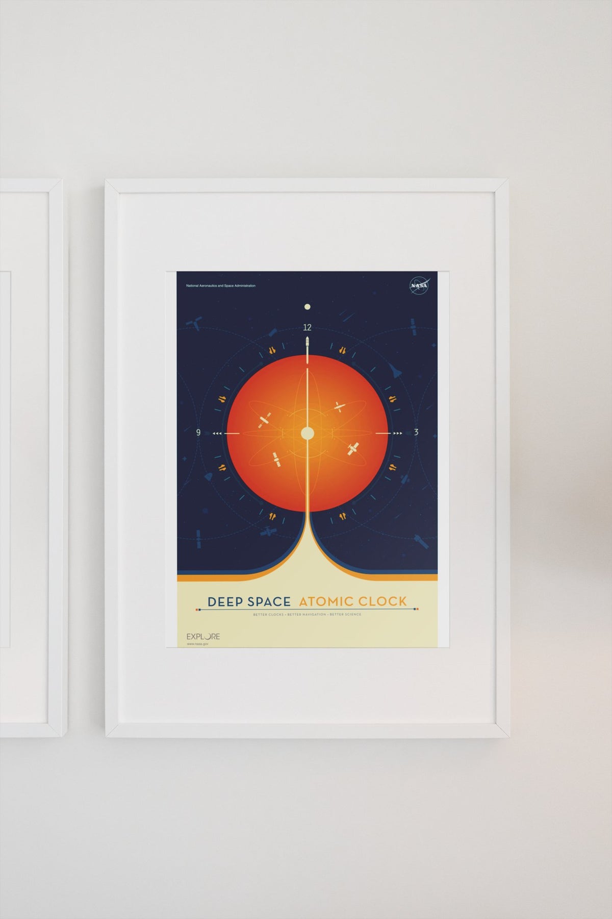 Deep Space Atomic Clock, orange poster in a white frame on a light wall