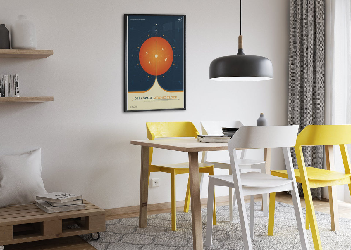 Deep Space Atomic Clock, orange poster framed above a dining table